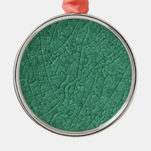 Ornament aus grünem Stein Metall (Vorne)