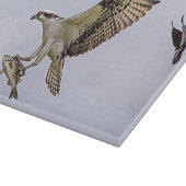 Osprey, der durch eine rotgeflügelte Amsel gejagt Schneidebrett (Ecke)