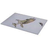 Osprey, der durch eine rotgeflügelte Amsel gejagt Schneidebrett (Ecke)