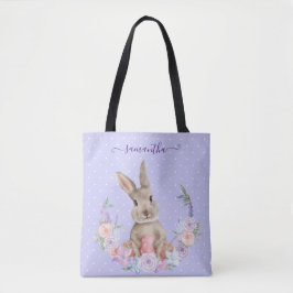 Osterhase im Blumengarten mit Ostereier Tasche