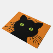 Oversifizierte schwarze Katze mit grünen Wucheln Fußmatte (Schrägansicht)