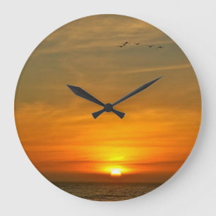 OZEAN-SONNENUNTERGANG MIT ZUGVÖGELN GROßE WANDUHR