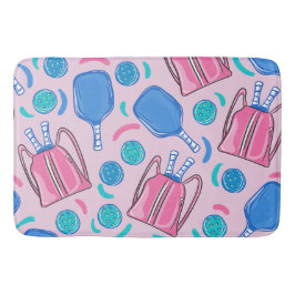 Paddeln und Bälle in Rosa Badematte