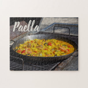 Paella wird auf einem Grillgeschenk für Koch gekoc Puzzle