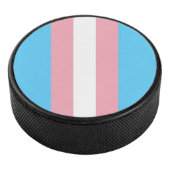 pale trans flag on hockey puck (3/4)