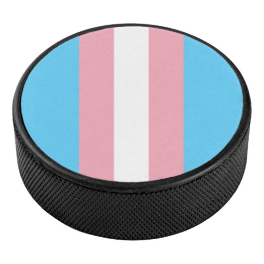 pale trans flag on hockey puck (3/4)