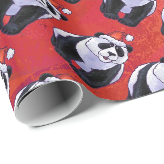 Panda-Bär in der Weihnachtsmannmütze auf Rot Geschenkpapier (Rolleneckpunkt)