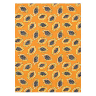 Papaya-Scheiben auf Orange Tischdecke