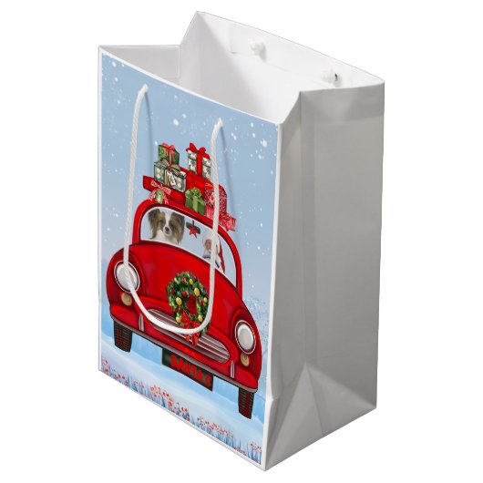 Papillon Dog in Auto mit dem Weihnachtsmann Mittlere Geschenktüte (Vorderseite Schrägansicht)