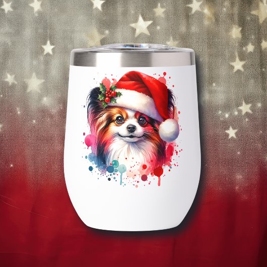 Papillon Dog in der Weihnachtsmannmütze Weihnachte