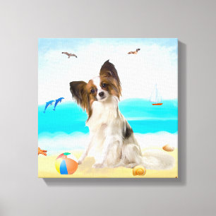 Papillon-Hund am Strand Leinwanddruck