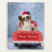 Papillon Hund im Schnee sitzen im Weihnachtswagen Planer (Vorderseite)