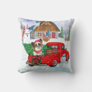 Papillon-Hund im Weihnachtslieferwagen Schnee Kissen