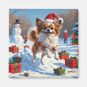 Papillon Hund läuft im Schnee mit Weihnachtshut Magnet (Vorne)