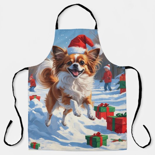 Papillon Hund läuft im Schnee mit Weihnachtshut Schürze (Vorderseite)