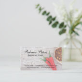 Paprikaschoten und Flocken aus Chili auf Holztisch Visitenkarte (Stehend Vorderseite)