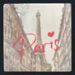 Paris Stone Untersetzer<br><div class="desc">Dieser elegante und stilvolle Untersetzer aus Stein zeigt ein Aquarellbild des Eiffelturms, das durch eine Seitenstraße zu sehen ist - und erinnert an Erinnerungen von Pariser Reisen und das französische Straßenleben! Das Wort "Paris" in leuchtend rot mit einem Herz fügt eine stilvolle und moderne Touch hinzu - Sie können diesen...</div>
