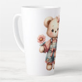 Pastel Teddy Bear Holding Blume Tragen Overalls Milchtasse (Linke Ecke)