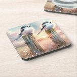 Pastel Watercolor Birds Fencepost Sunset Getränkeuntersetzer<br><div class="desc">Soft watercolor brushwork captures two fluffy songbirds resting on weathered fence posts as a glowing sunset spreads across a dreamy countryside sky. Gentle washes of peach, blush pink, pale blue, and warm gold blend into a tranquil horizon, creating a calm pastoral atmosphere. The birds appear round and feathery, their delicate...</div>