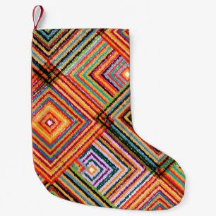 Patchwork-Design mit Aztec-Quadraten. Kleiner Weihnachtsstrumpf