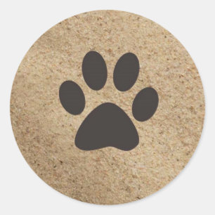 Paw Prints im Sand Runder Aufkleber