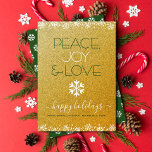 Peace Joy Liebe Typografie Snowflake Gold Glitzer<br><div class="desc">"Frieden, Freude und Liebe." Eine lustige, spielerische, weiße Schneeflocke-Illustration und eine moderne Typografie auf funkelnd, Imitat Gold Glitzer Hintergrund helfen Ihnen, in der Ferienzeit. Weiße Schneeflocken und Konfetti-Punkte umrahmen die Karte. Ein weißes Schneeflockenmuster überlagert dunkelgrün auf der Rückseite. Fühlen Sie die Wärme und Freude der Ferien, wenn Sie diese atemberaubende,...</div>