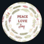 Peace Liebe JoSimple Rustic Christmas Foliage Runder Aufkleber<br><div class="desc">Diese Aufkleber sind ideal für Geschenkverpackungen oder Umschlag Aufkleber und haben eine rustikale Gestaltung von Weihnachtsblättern. Die Formulierung in der Mitte lautet "Peace Liebe and Joy" und ist gerahmt mit Kiefernringen,  Tannenästen,  Weihnachtsschmuck,  Heiligen,  Mistelbeeren und Winterbeeren. Matching Geschenkpackungen und Urlaubskarten sind in unserem Shop erhältlich.</div>