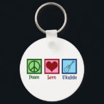 Peace Liebe Ukulele Schlüsselanhänger<br><div class="desc">Peace Liebe Ukulele. Niedliches Ukuleles-Spielgeschenk mit einem coolen Friedenszeichen,  Herz und kauem Instrument.</div>