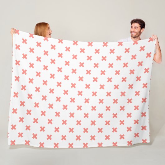 Peach cross stitches auf weiß fleecedecke (Beispiel)