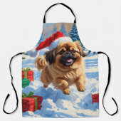Pekingese Hund läuft im Schnee mit Weihnachtshut Schürze (Vorderseite)