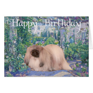 Pekingese in einem Blumengarten