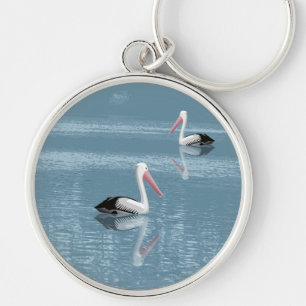Pelican Couple Paddling auf Calm Blue Water Schlüsselanhänger