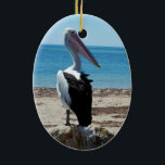 Pelican On Beach Rock, Keramikornament<br><div class="desc">Stehend auf einem Stein am Meer ist ein hungrig hübscher Pelikan,  der für tasy-Fische-Muscheln gewartet ist.</div>