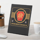 Pennsylvania Eisenbahn-Logo schwarz und gold Sockelschild (In SItu)