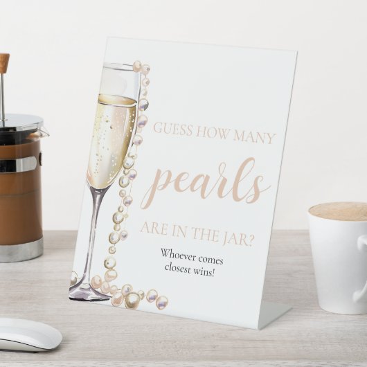 Perlen und Prosecco schätzen, wie viele Perlen spi Sockelschild (In SItu)