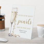 Perlen und Prosecco schätzen, wie viele Perlen spi Sockelschild (In SItu)