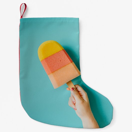 Person mit gelbem und rosa Popsiv Kleiner Weihnachtsstrumpf (Vorderseite)