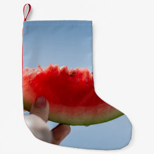 Person mit Wassermelone in Scheiben Kleiner Weihnachtsstrumpf