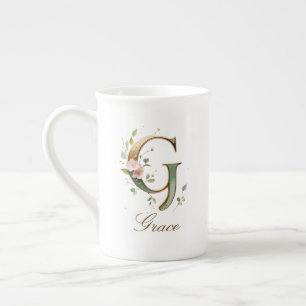 Personalisierte goldene Blumenmonogramm-Initiale G Porzellantasse