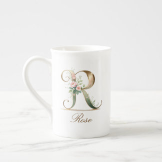 Personalisierte goldene Blumenmonogramm-Initiale R Porzellantasse