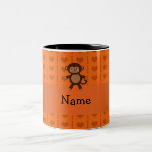 Personalisierte Namensspielzeugaffe-Orangenherzen Zweifarbige Tasse