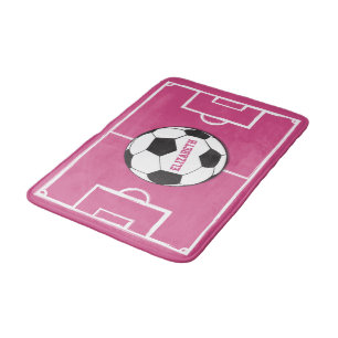 Personalisierter Fußballball und Felsrosa Badematte