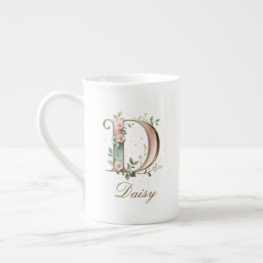 Personalisierter goldener Blumenmonogramm-Initiale Porzellantasse (Links)