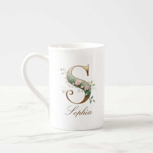 Personalisierter goldener Blumenmonogramm-Initiale Porzellantasse (Links)