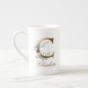 Personalisierter goldener Blumenmonogramm-Initiale Porzellantasse