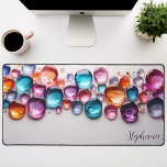 Personalisierter Rainbow Gemstone Schreibtischunterlage<br><div class="desc">Mit dieser personalisierten Schreibtischmatte, die mit lebendigen Regenbogensteinen geschmückt ist, lassen Sie sich eine Touch Zauber und Glanz in Ihren Arbeitsbereich bringen. Die farbenfrohen Kristalle, das Set vor einem schwarzen Hintergrund, schaffen eine faszinierende und inspirierend Szene. Machen Sie es wahrhaft, indem Sie Ihren Namen oder ein motivierend Zitat hinzufügen. Die...</div>