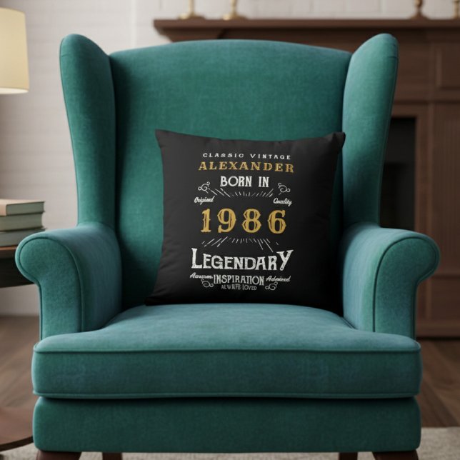 Personalized 40th Birthday Born 1986 Legend Black Kissen (Born 1986 throw pillow on a green chair.)