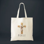 Personalized Floral Cross Religious Easter Tote Tragetasche<br><div class="desc">This beautifully personalized Easter tote bag showcases a rustic wooden cross adorned with soft watercolor spring florals, making it a meaningful and elegant gift for the Easter season. Add any name to create a heartfelt custom keepsake perfect for church, First Communion, Confirmation, or Easter Sunday celebrations. It's an ideal gift...</div>