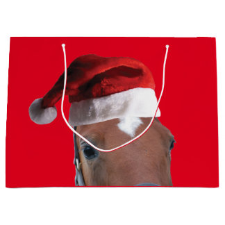 Pferd mit einem Weihnachtshut Große Geschenktüte