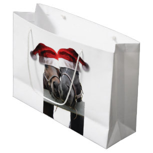 Pferde mit dem Weihnachtsmann Hats Große Geschenktüte